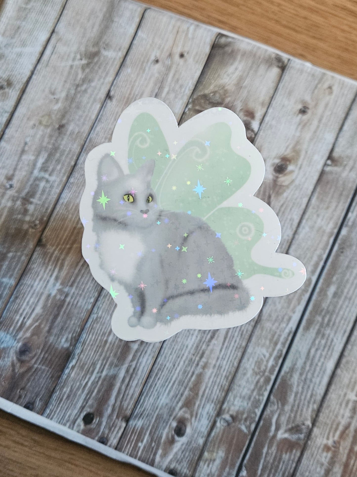 Gray cat with fairy wings sticker for water bottle