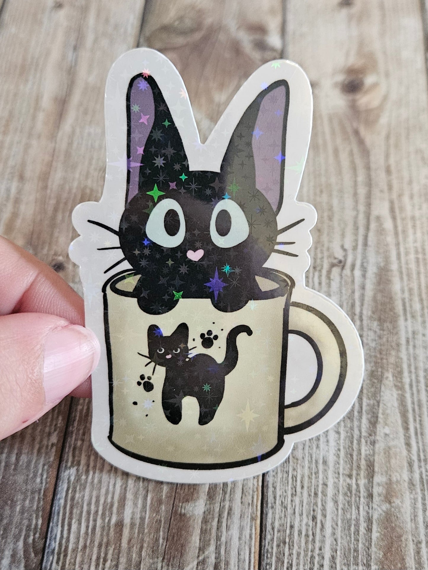 Black kitten in a cat mug sticker for laptop