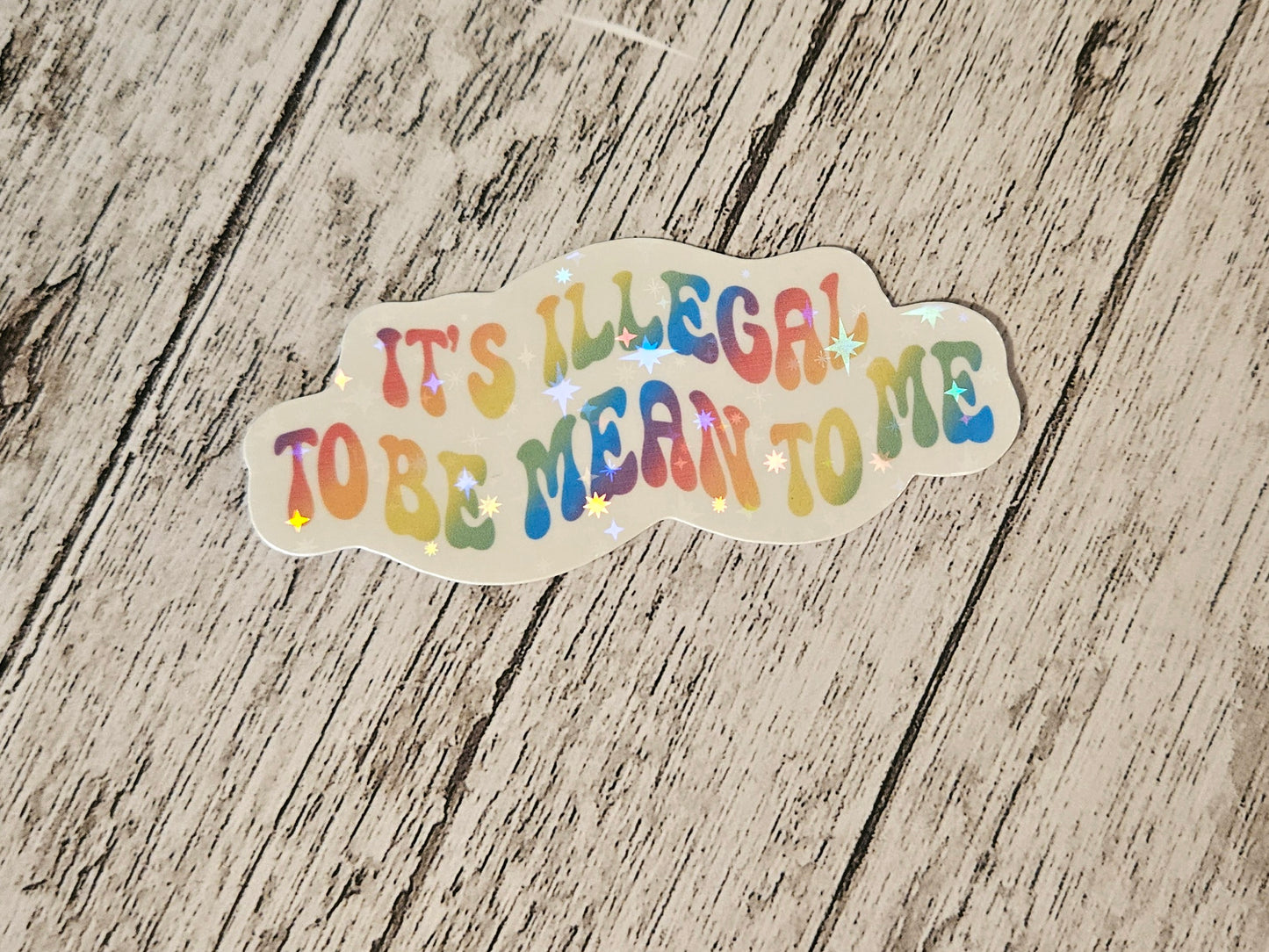 It's illegal to be mean to me sticker