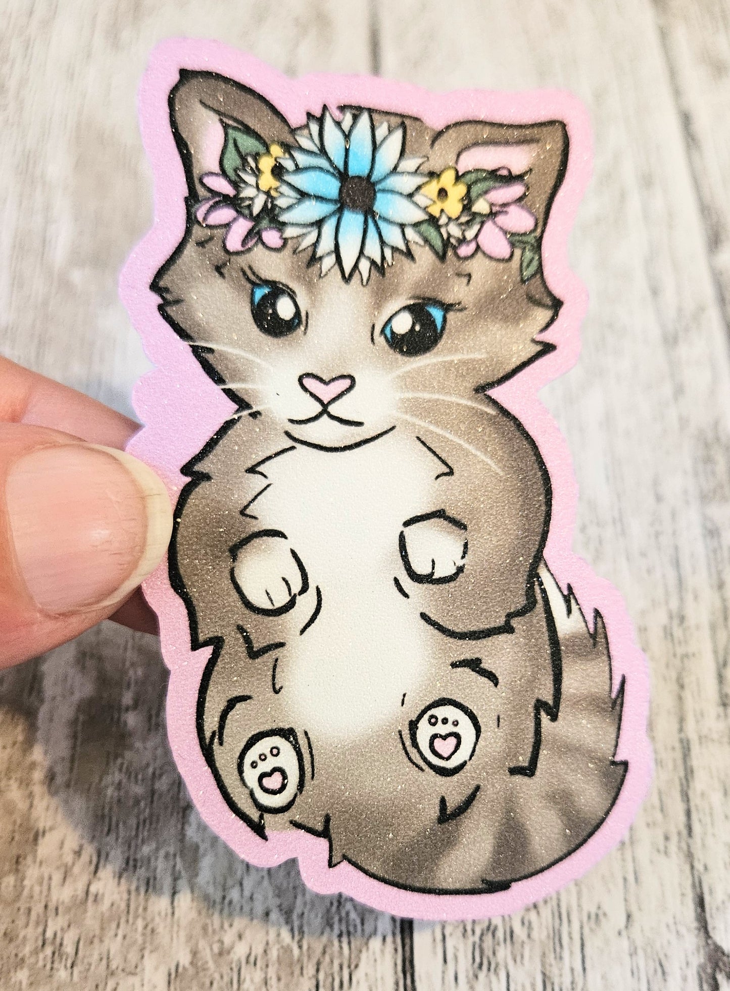 Sweet tabby kitten in a floral crown sticker