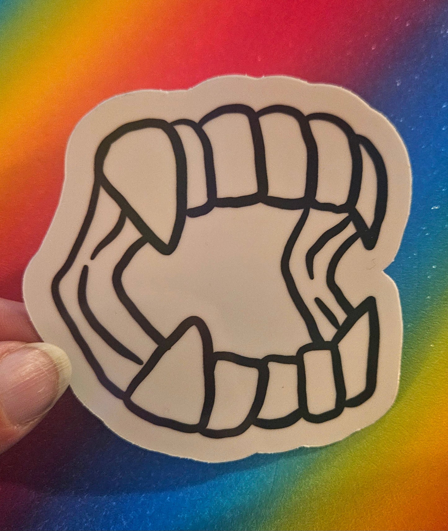 Plastic vampire teeth sticker