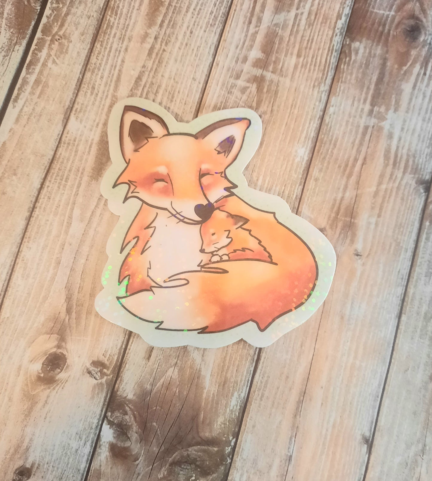 Fox and baby fox snuggles sticker