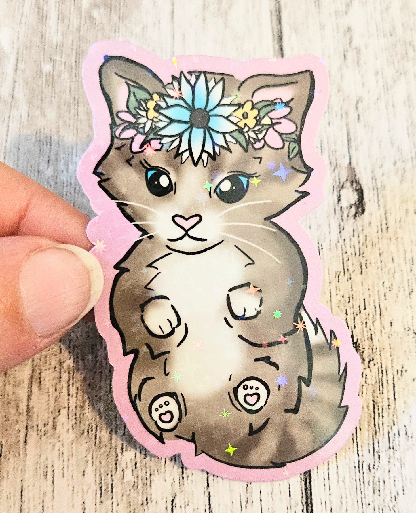 Sweet tabby kitten in a floral crown sticker