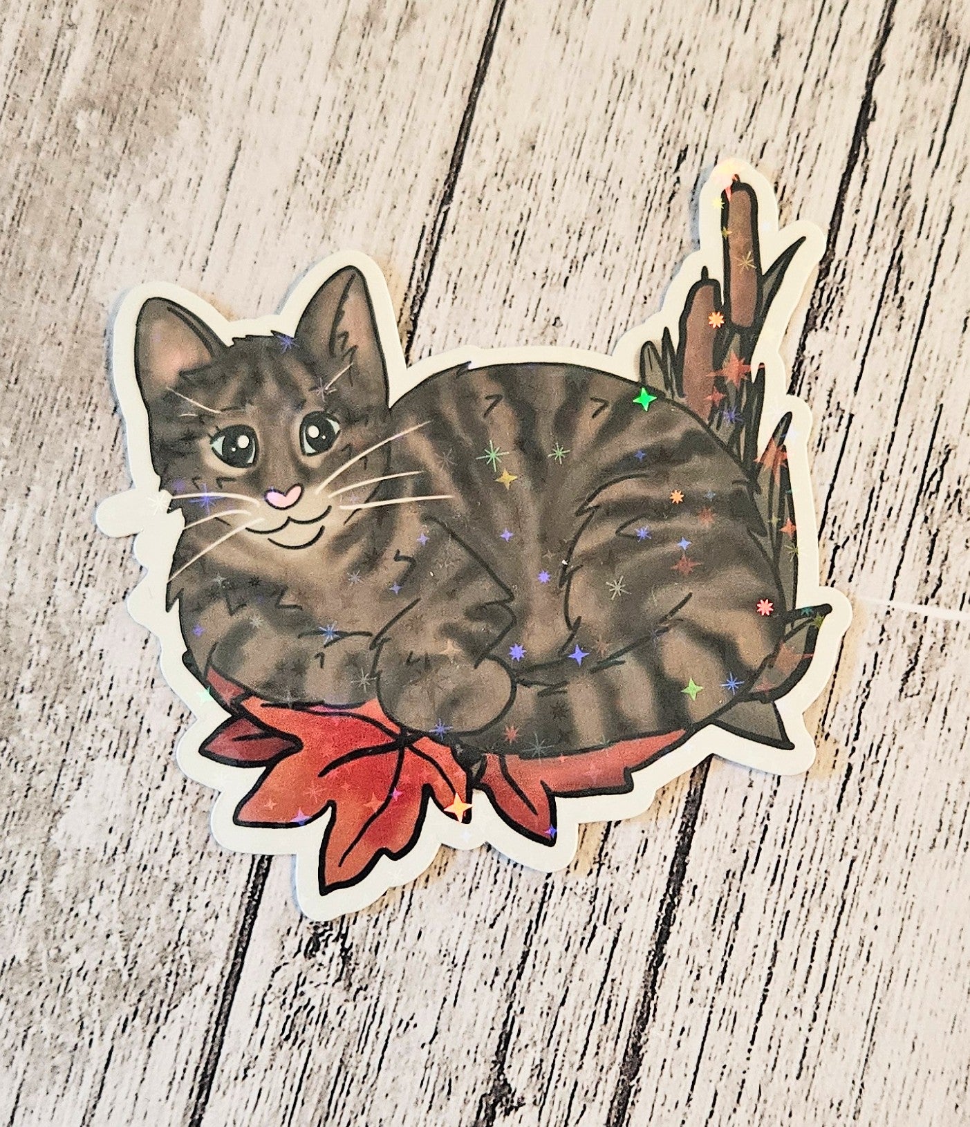 Tabby cat in leaves sticker