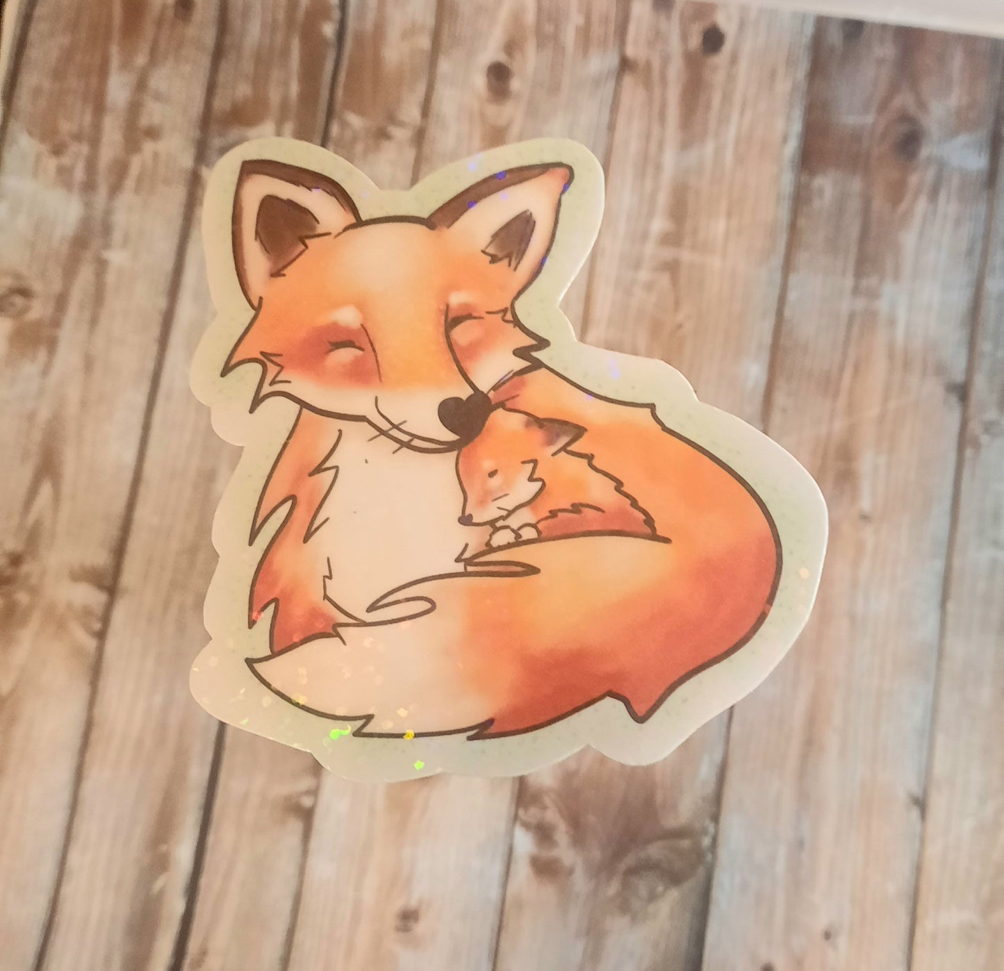 Fox and baby fox snuggles sticker