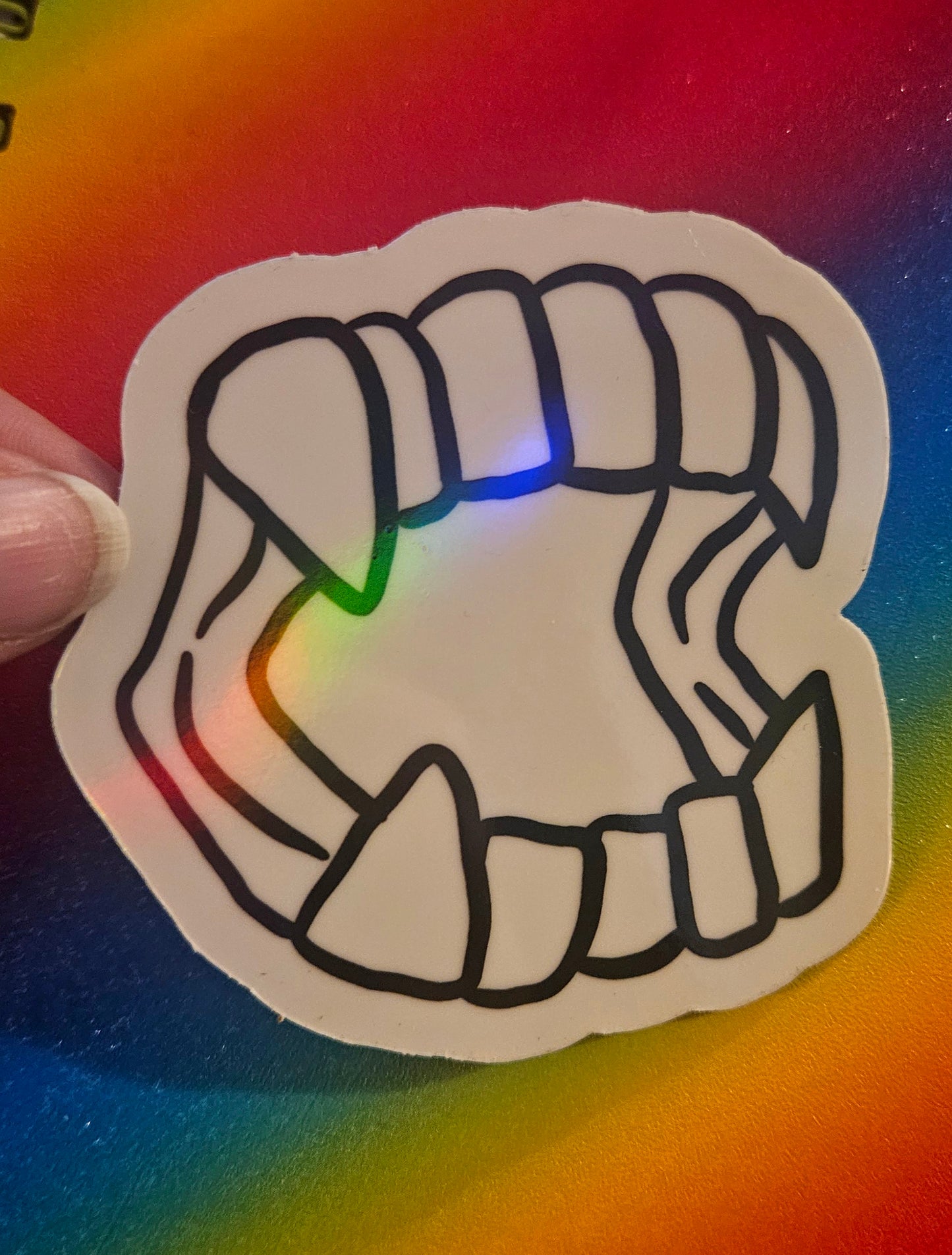 Plastic vampire teeth sticker
