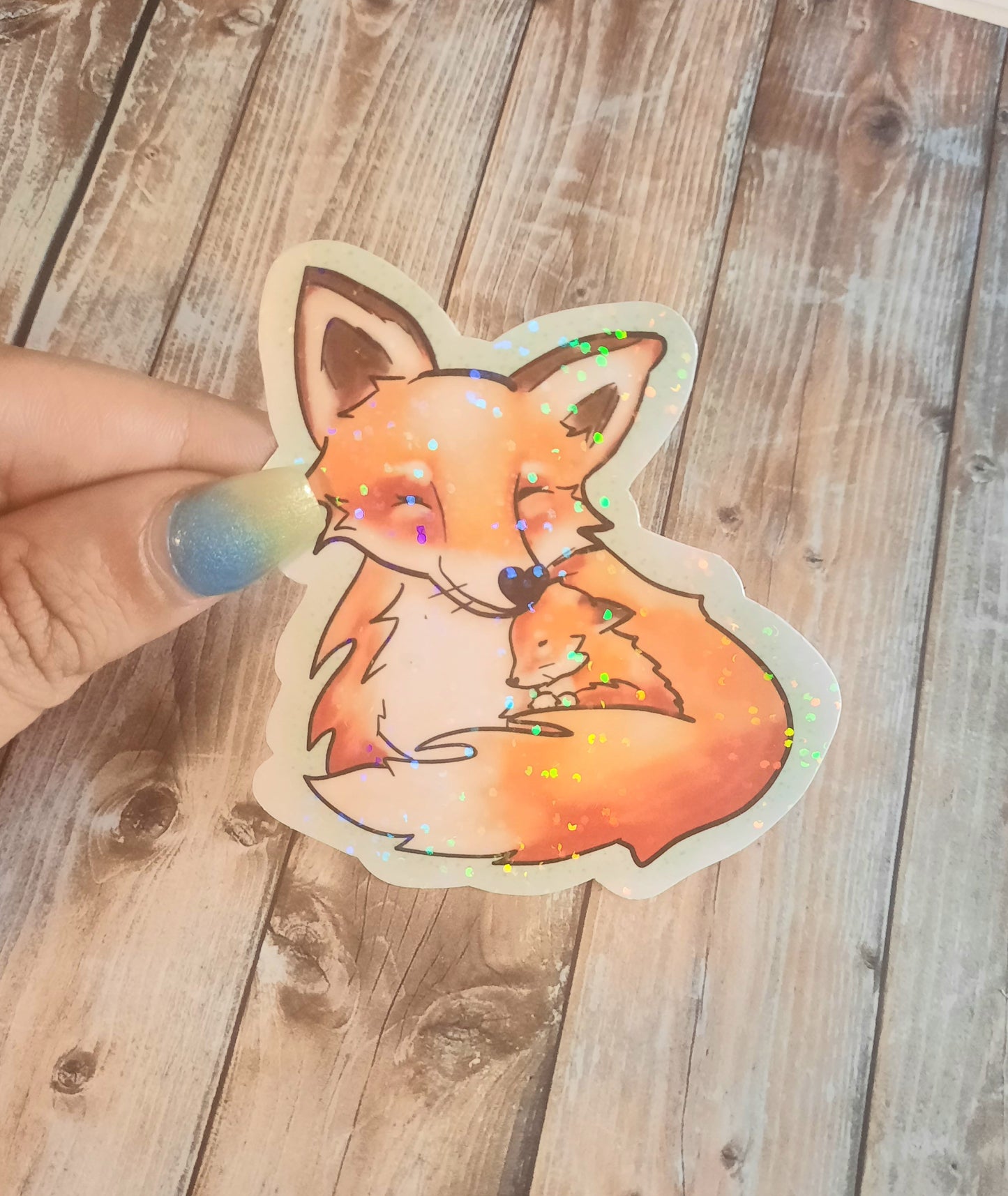 Fox and baby fox snuggles sticker